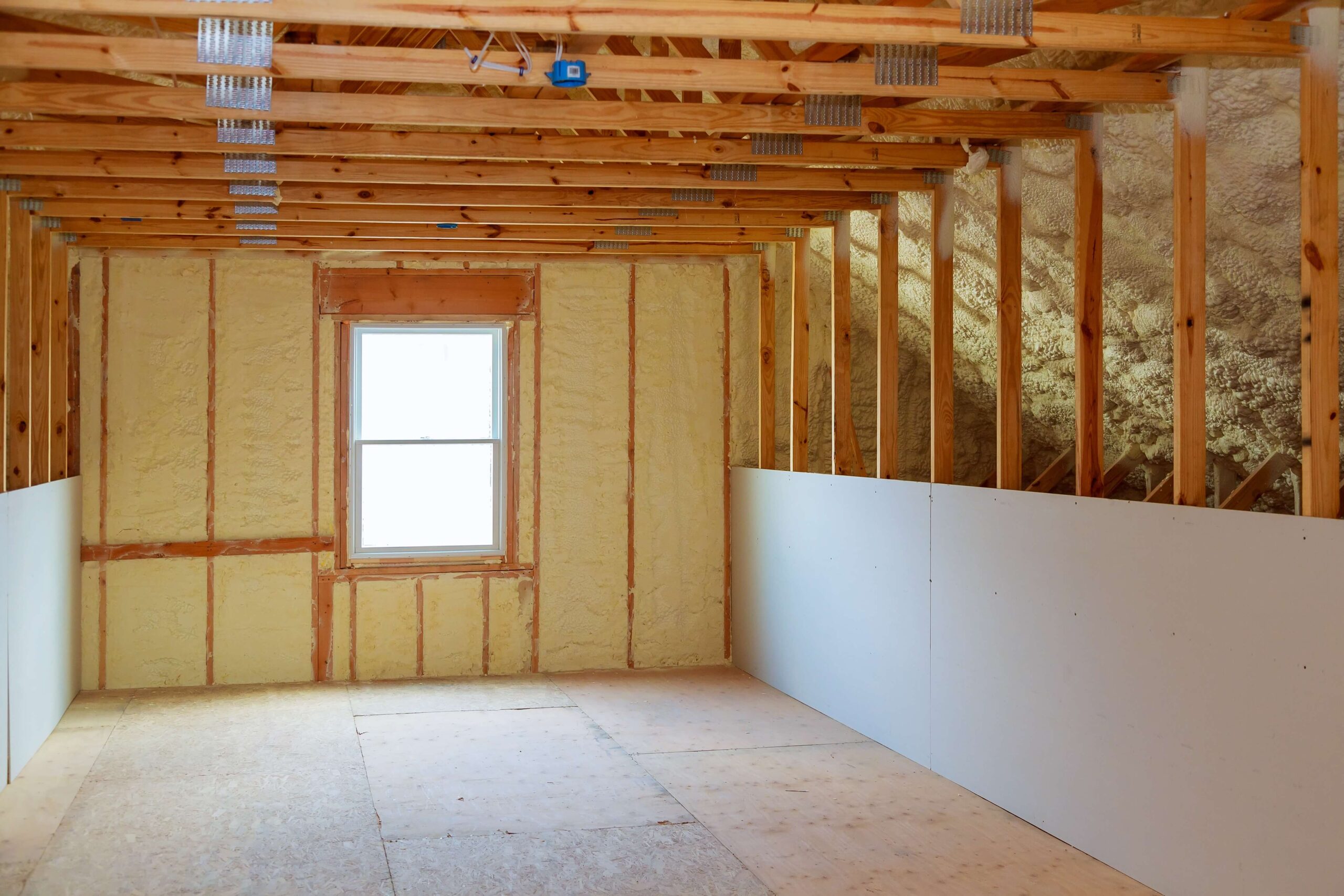 A room with wood framing and insulation.