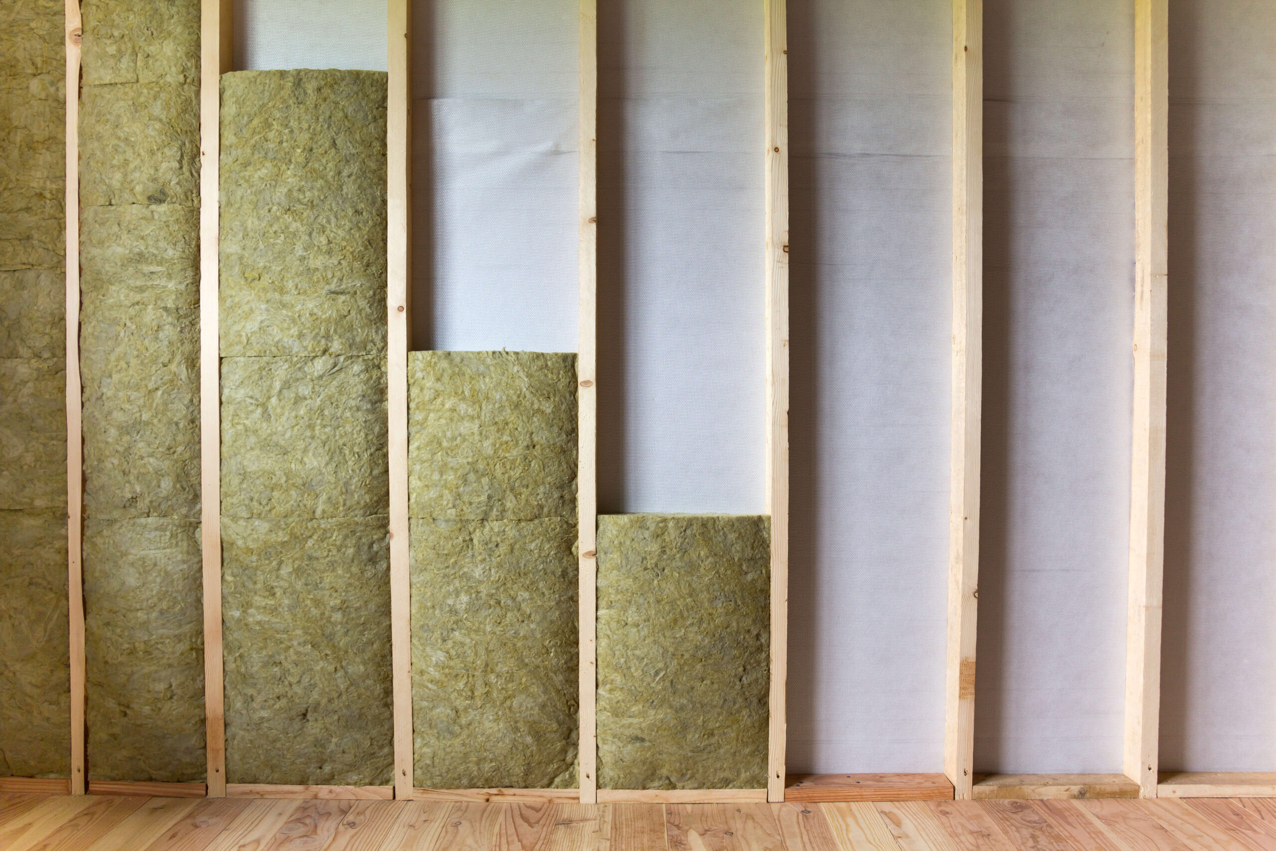 Insulation in a room with wood flooring.